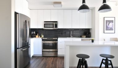 gray steel 3-door refrigerator near modular kitchen