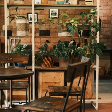 a room filled with wooden tables and chairs