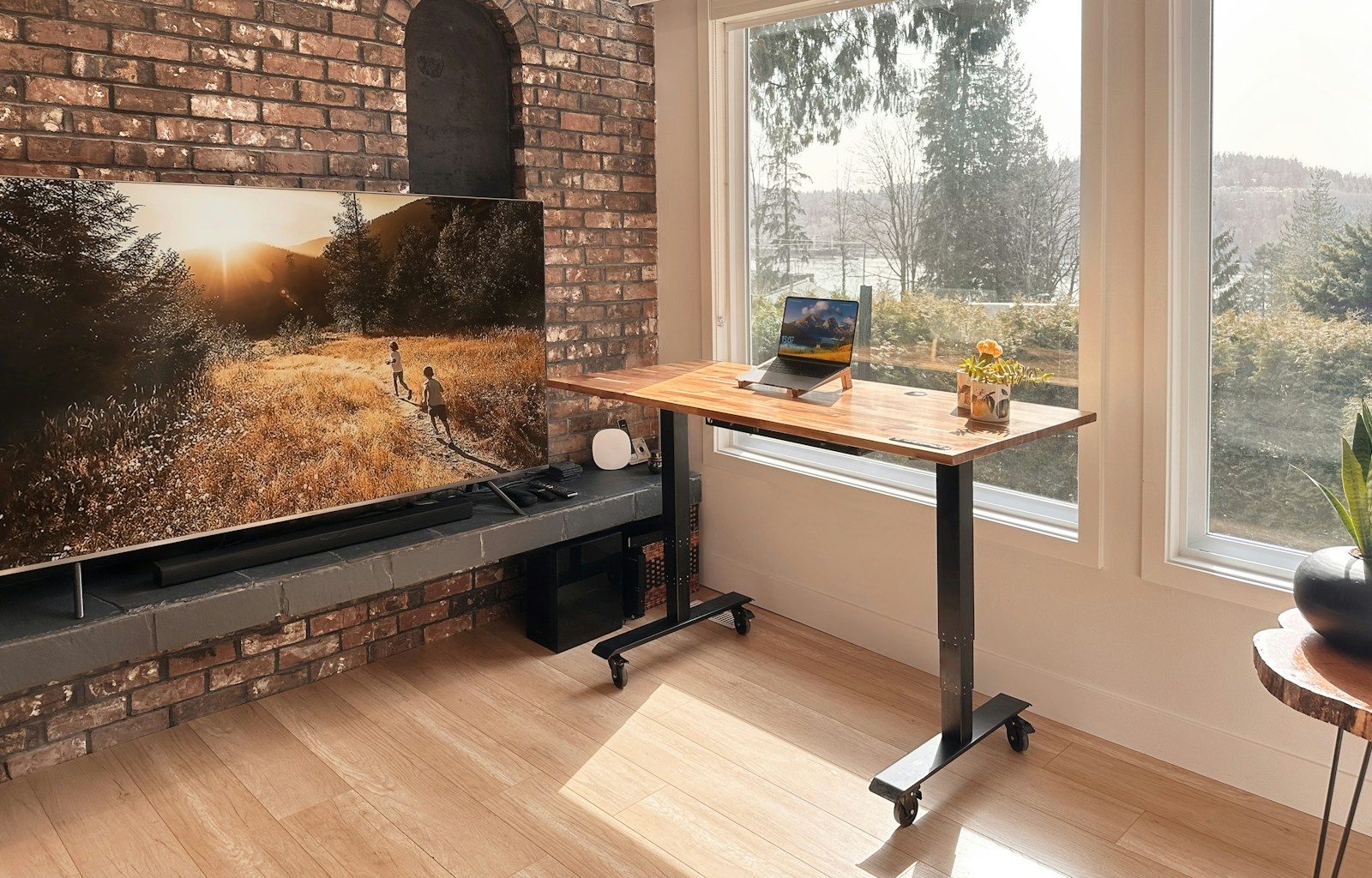 a flat screen tv sitting on top of a wooden table