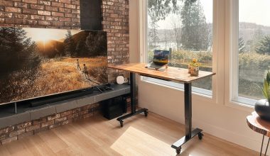 a flat screen tv sitting on top of a wooden table