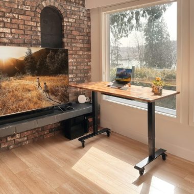 a flat screen tv sitting on top of a wooden table