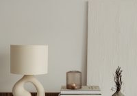 a lamp and books on a table