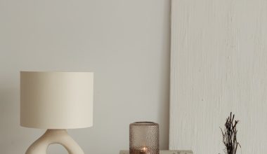 a lamp and books on a table