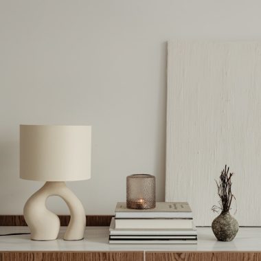 a lamp and books on a table