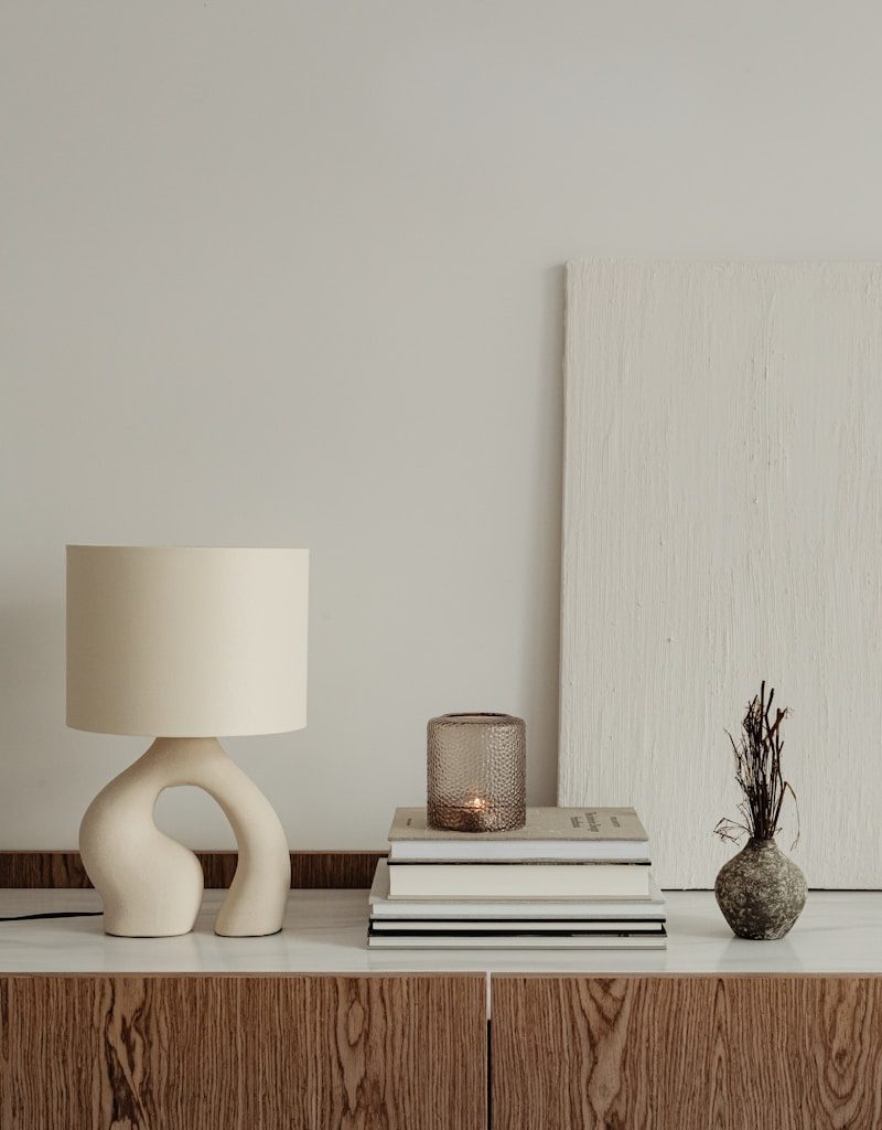 a lamp and books on a table