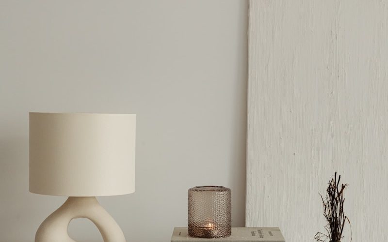 a lamp and books on a table