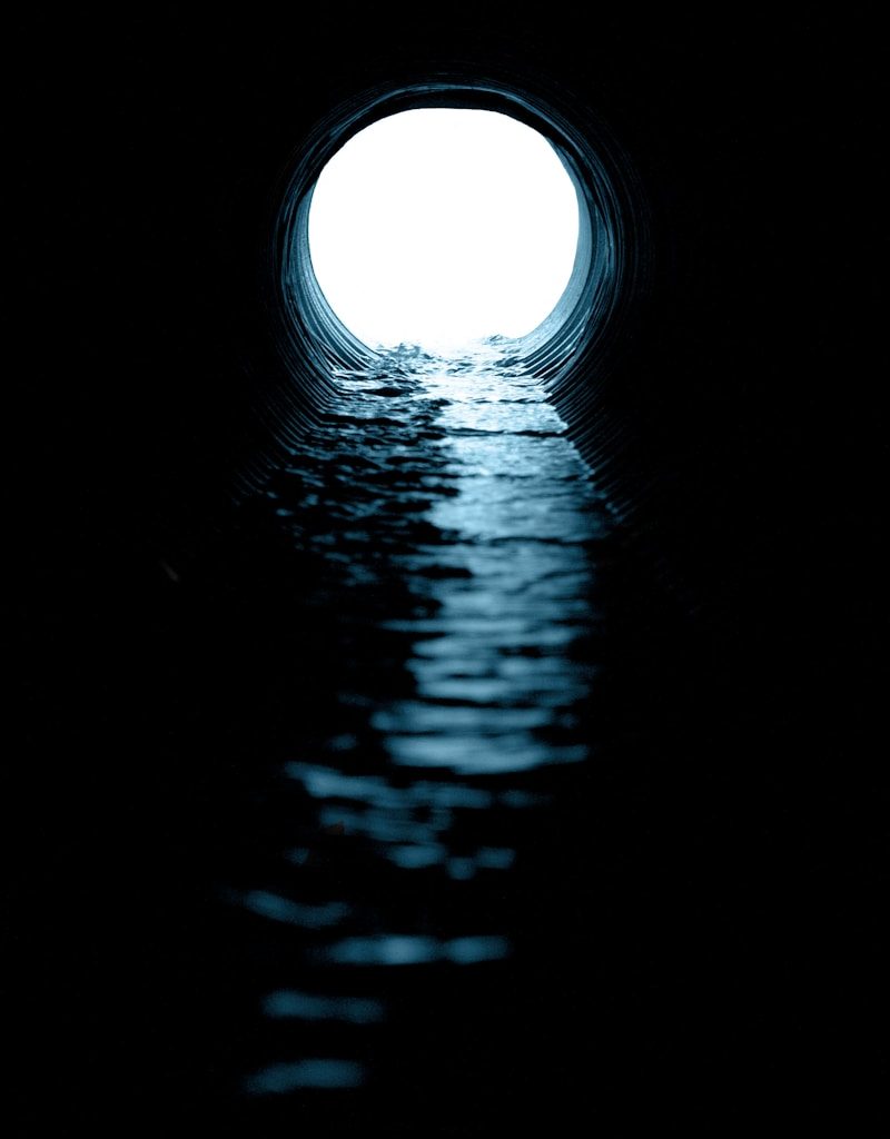 black and white tunnel with light